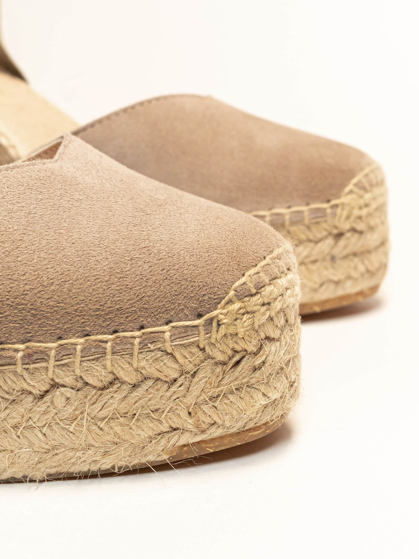 Beige espadrille sandals with jute sole on a white background