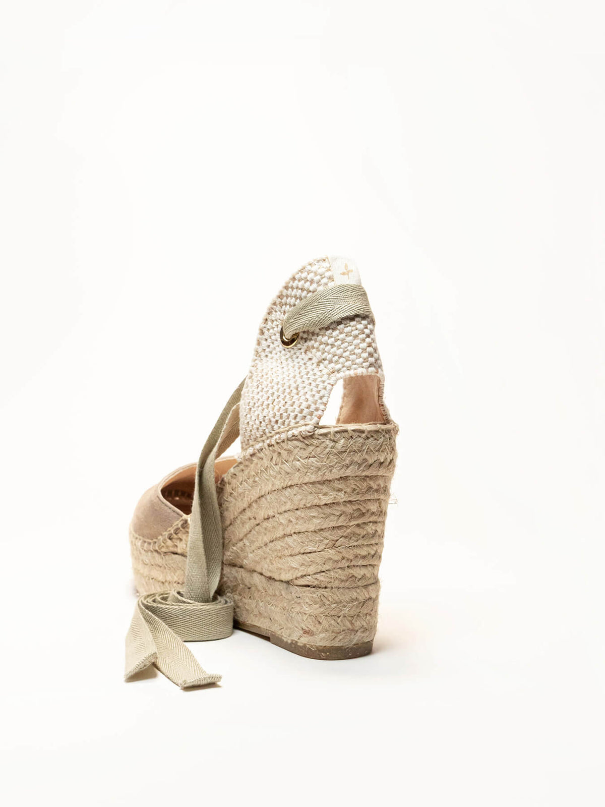Beige wedge sandal with jute sole on a white background